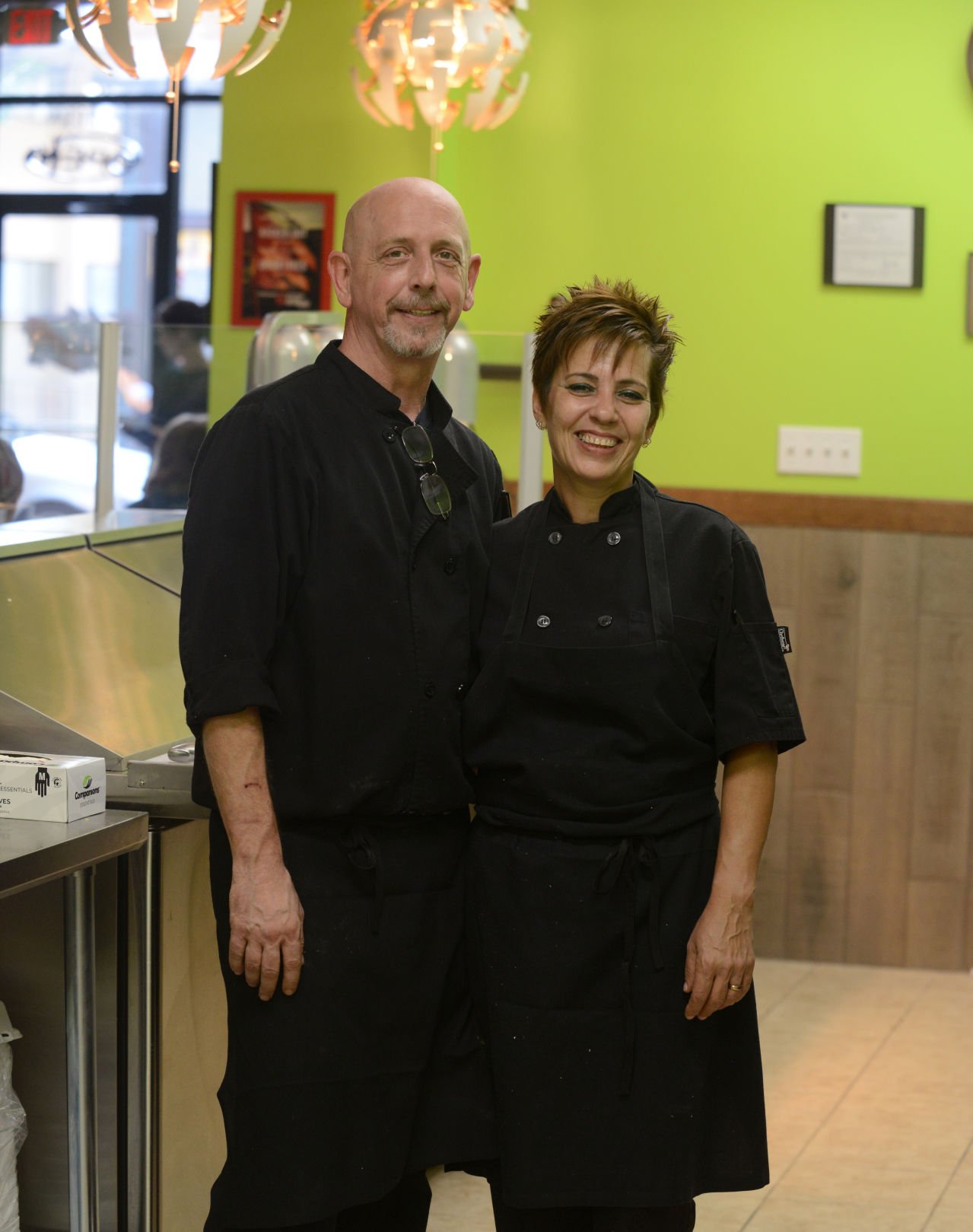 Greg Butler and Katy Ugalde stand in the kitchen of Sagua La Grande Cuban Cafe